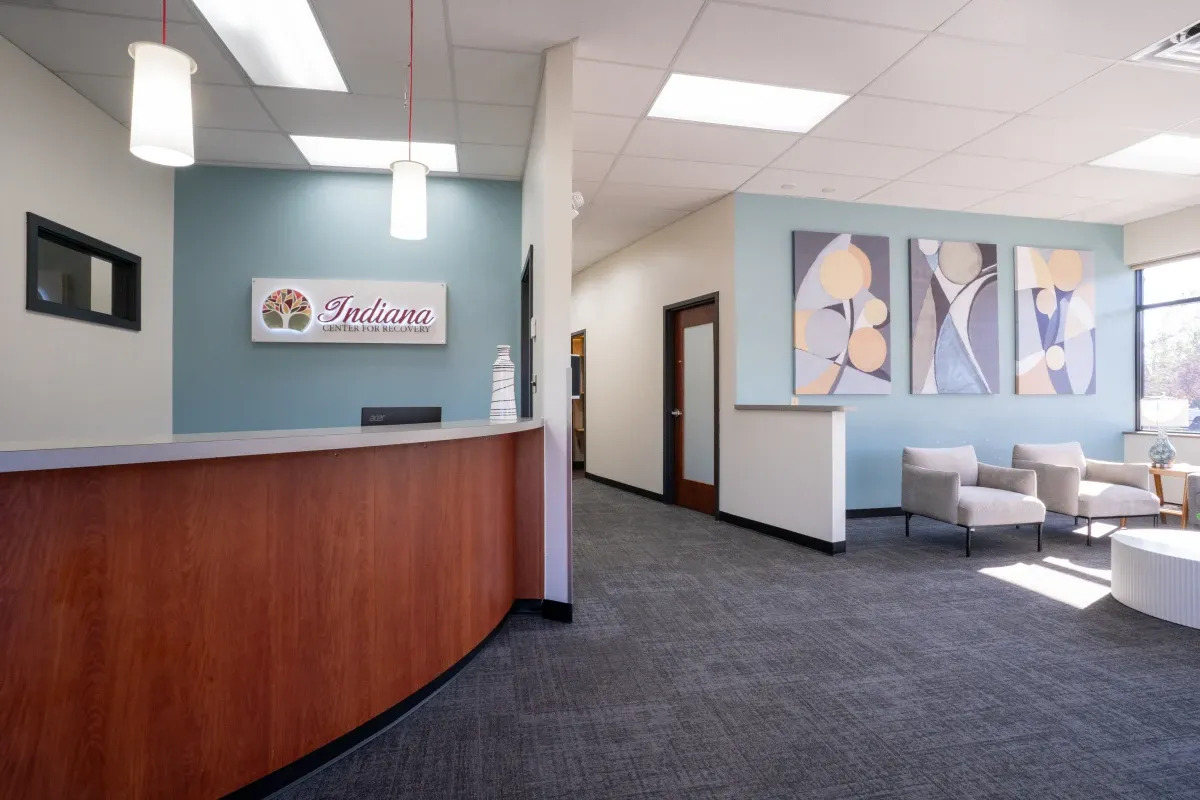 Reception desk and seating area in bright, modern treatment center.