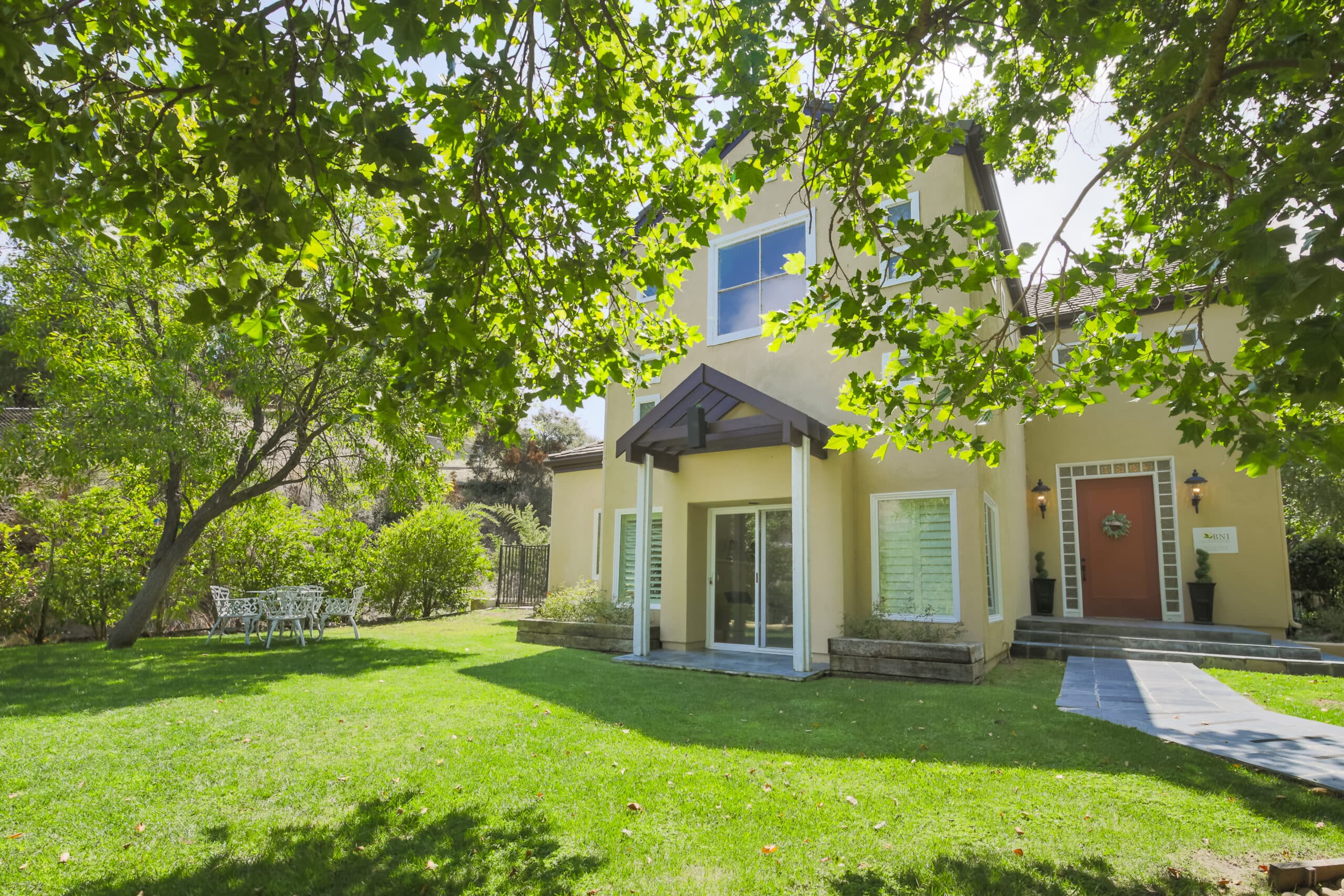 Outdoor garden area with patio table and chairs