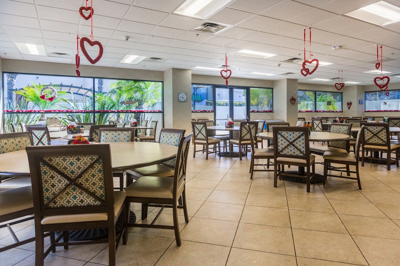  dining area with round tables, chairs, and heart-shaped decorations
