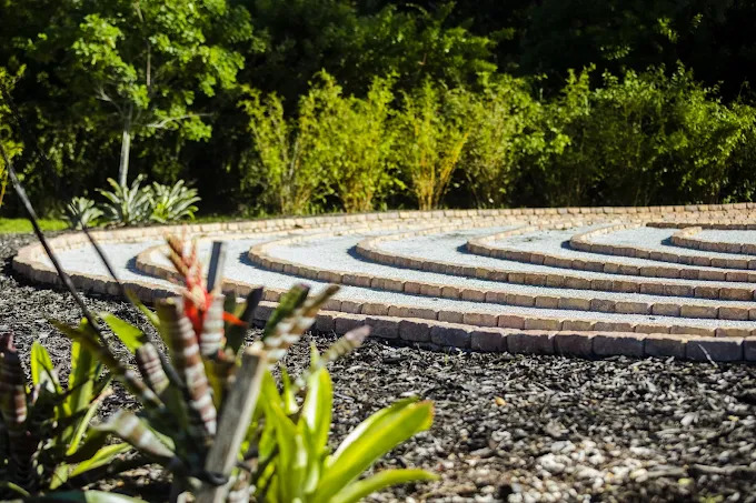 Circular stone labyrinth in a garden.