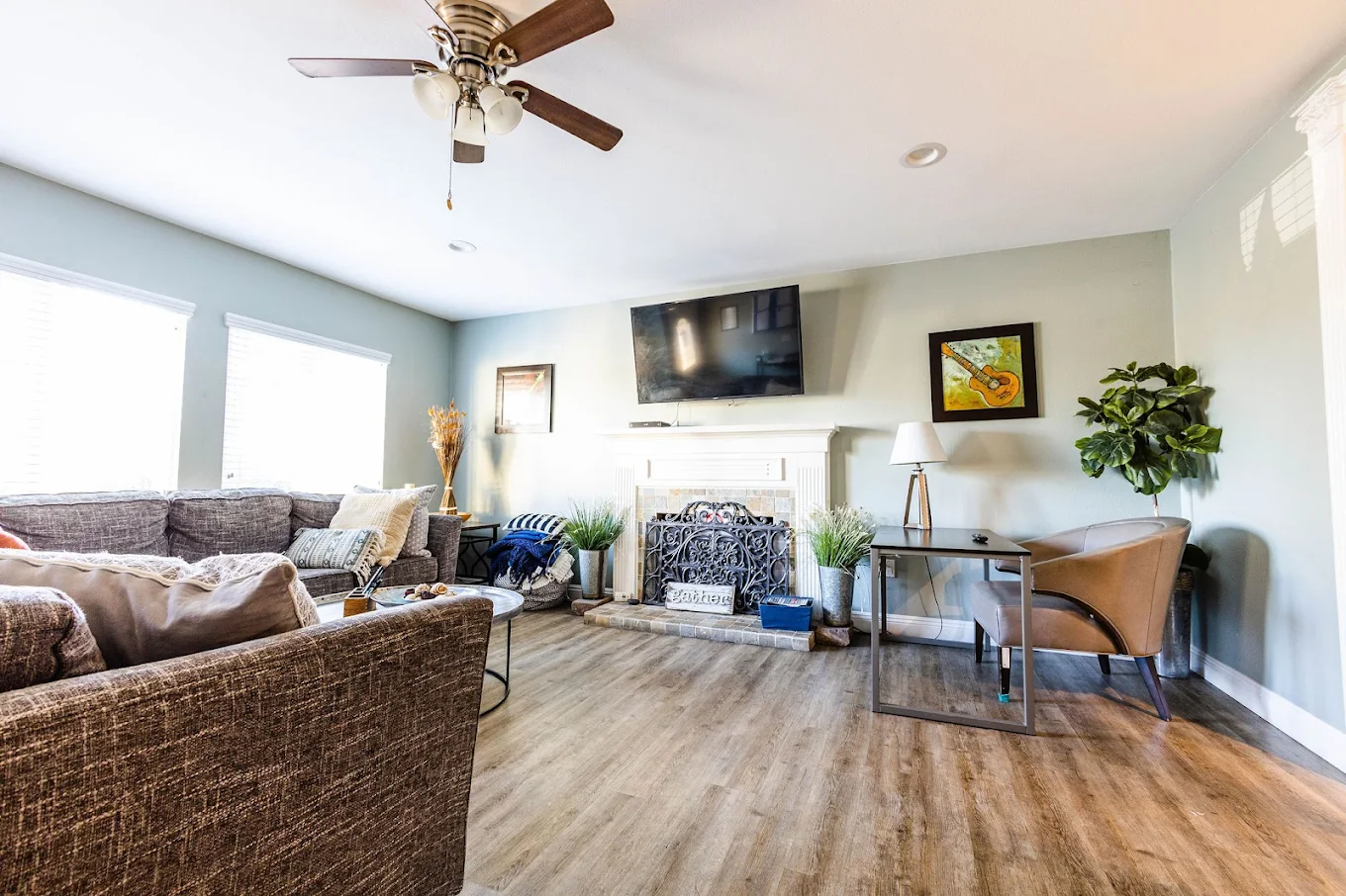 Lounge area with couches, fireplace, and TV