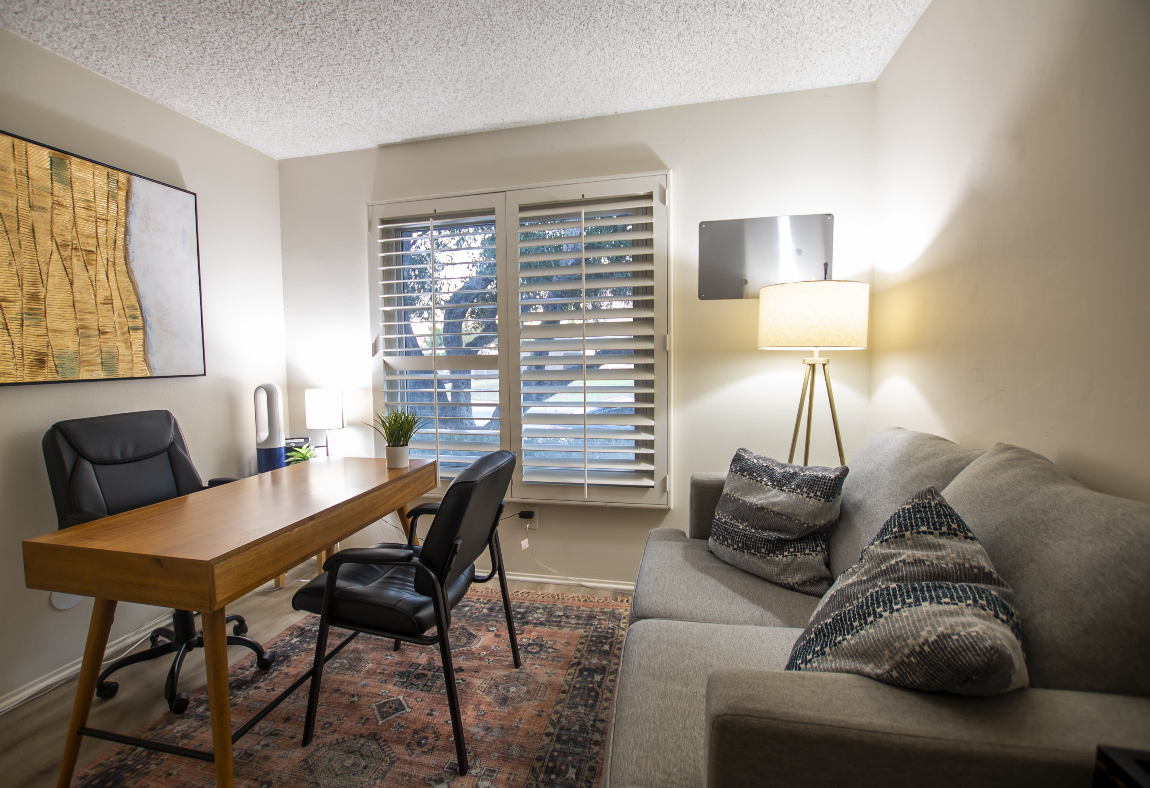 Private counseling room with desk and seating