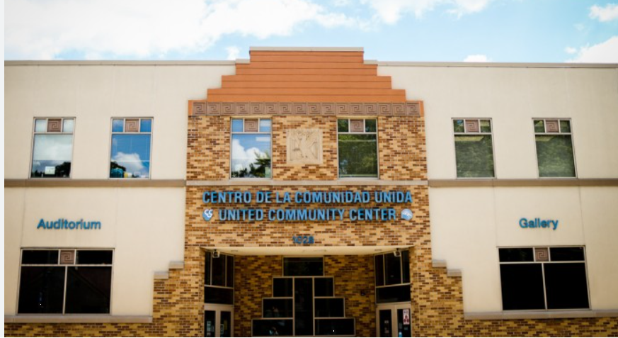 Brick and white building with “United Community Center” sign