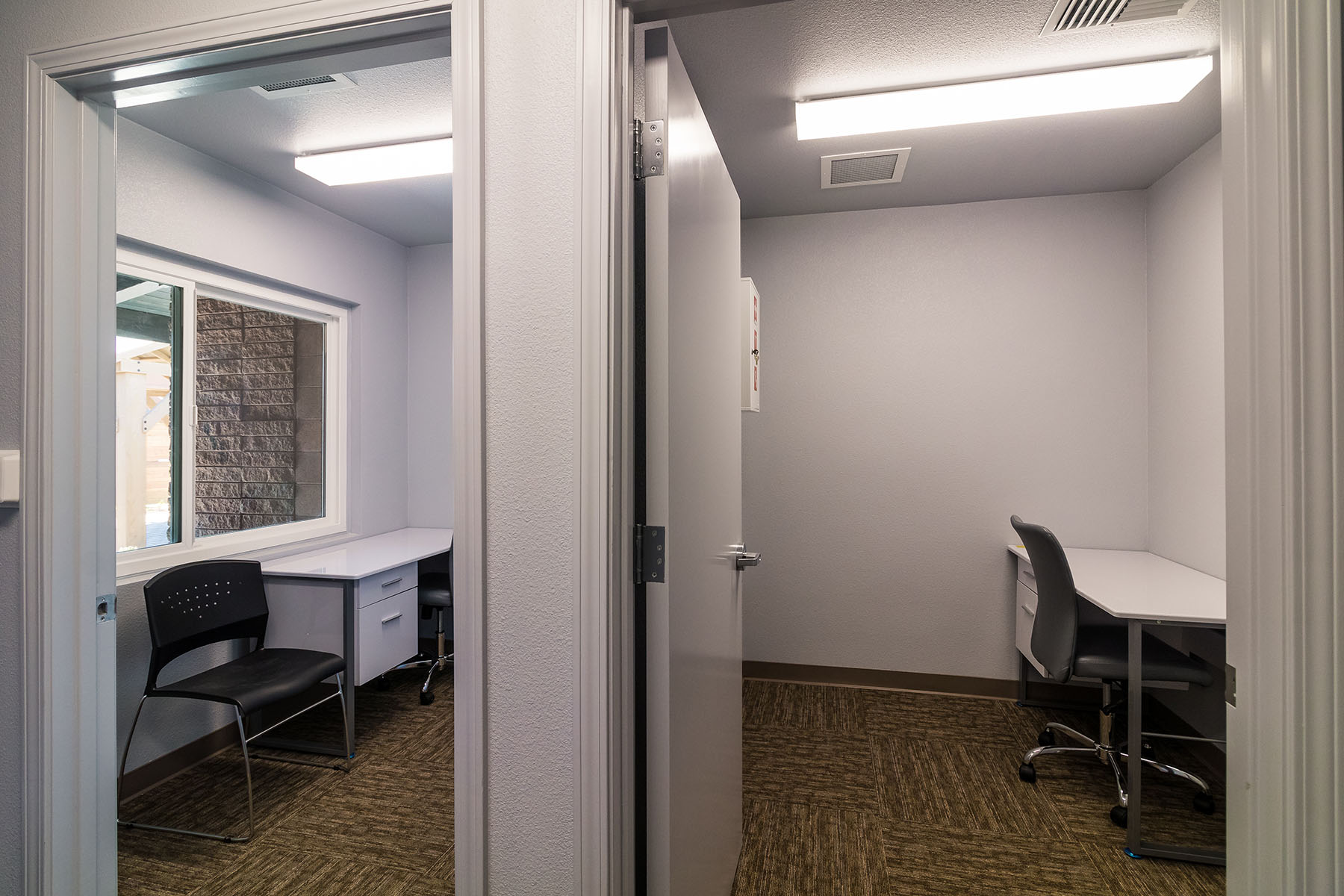Private counseling room with desk and seating