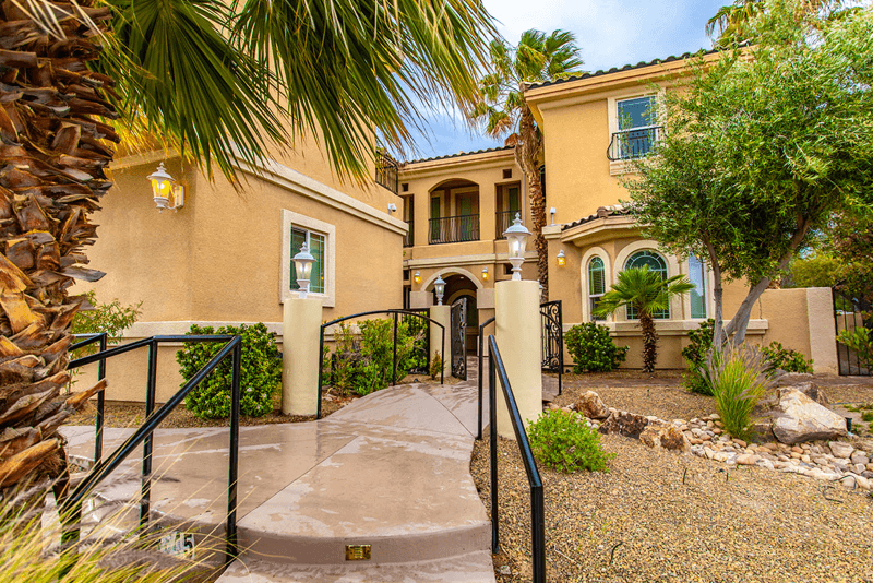 Facility exterior with a landscaped entrance pathway.