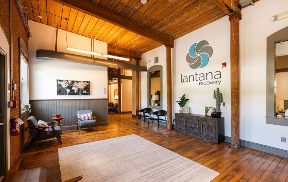 Reception lobby with wood floors and seating area