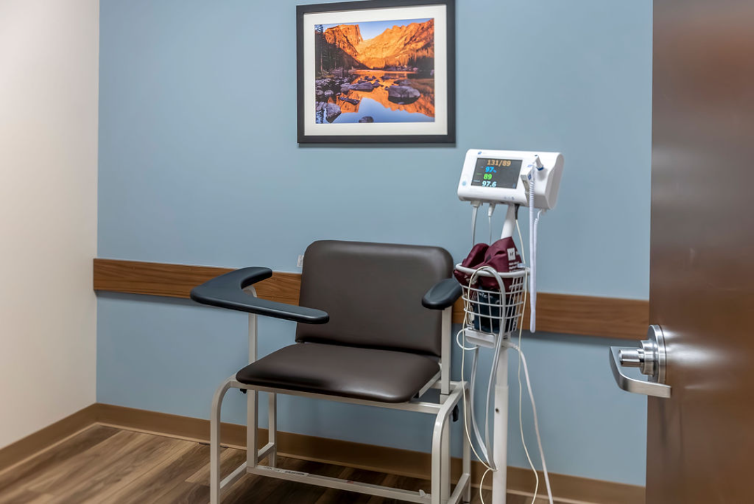 BrightView Health clinical room with patient chair and electronic vital-sign monitoring equipment