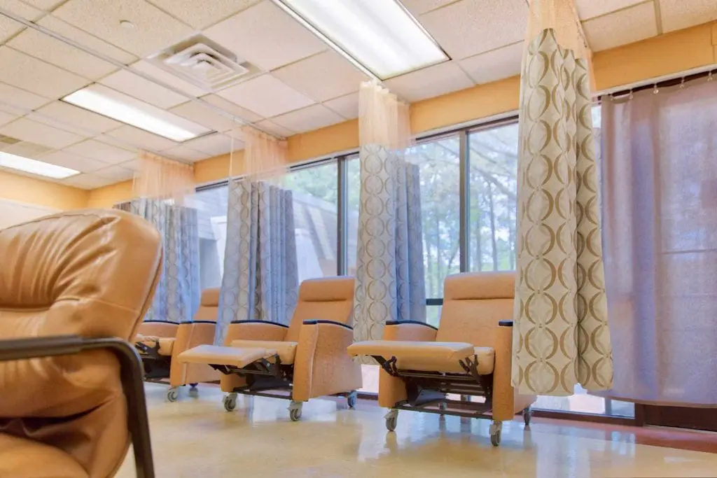 Treatment area with reclining chairs and privacy curtains