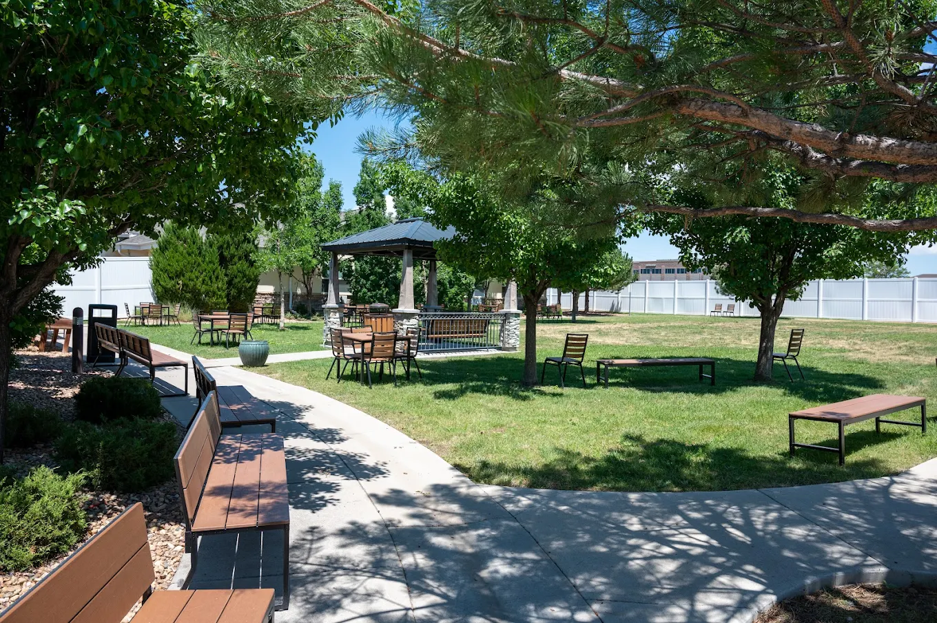 Landscaped courtyard with gazebo, benches, and walking paths