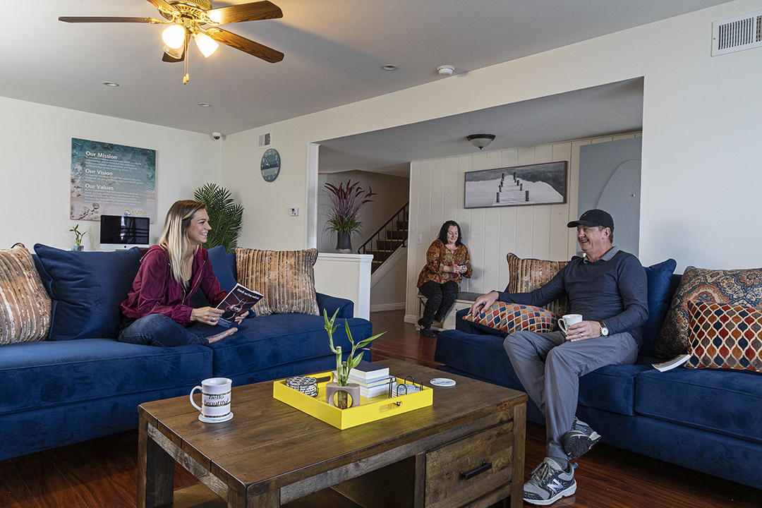 People chatting in bright, welcoming common area
