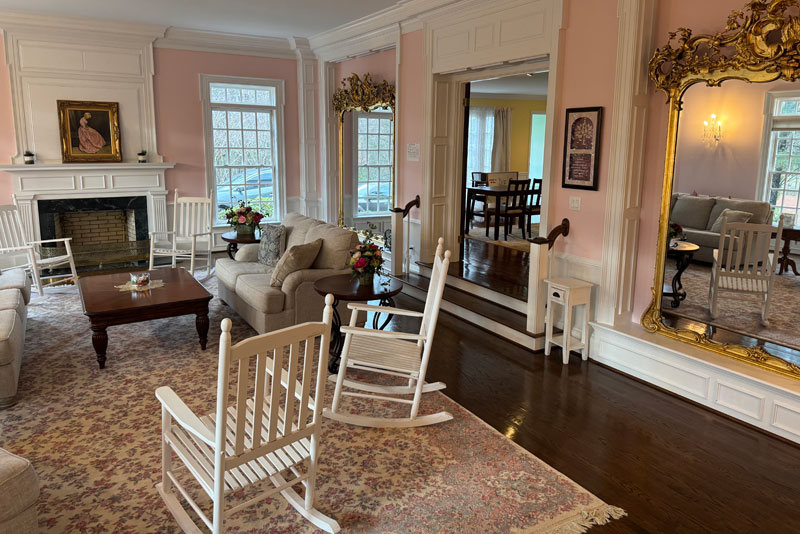 Elegant pink lounge with rocking chairs and sofas