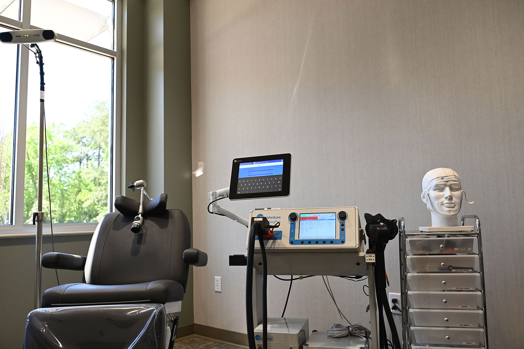 Treatment room with medical chair and monitoring equipment