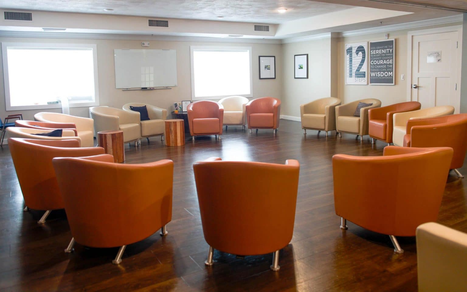 Group therapy room with a circular arrangement of chairs.