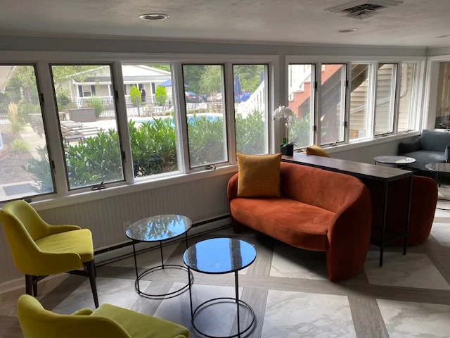 Colorful lounge with velvet chairs and modern decor