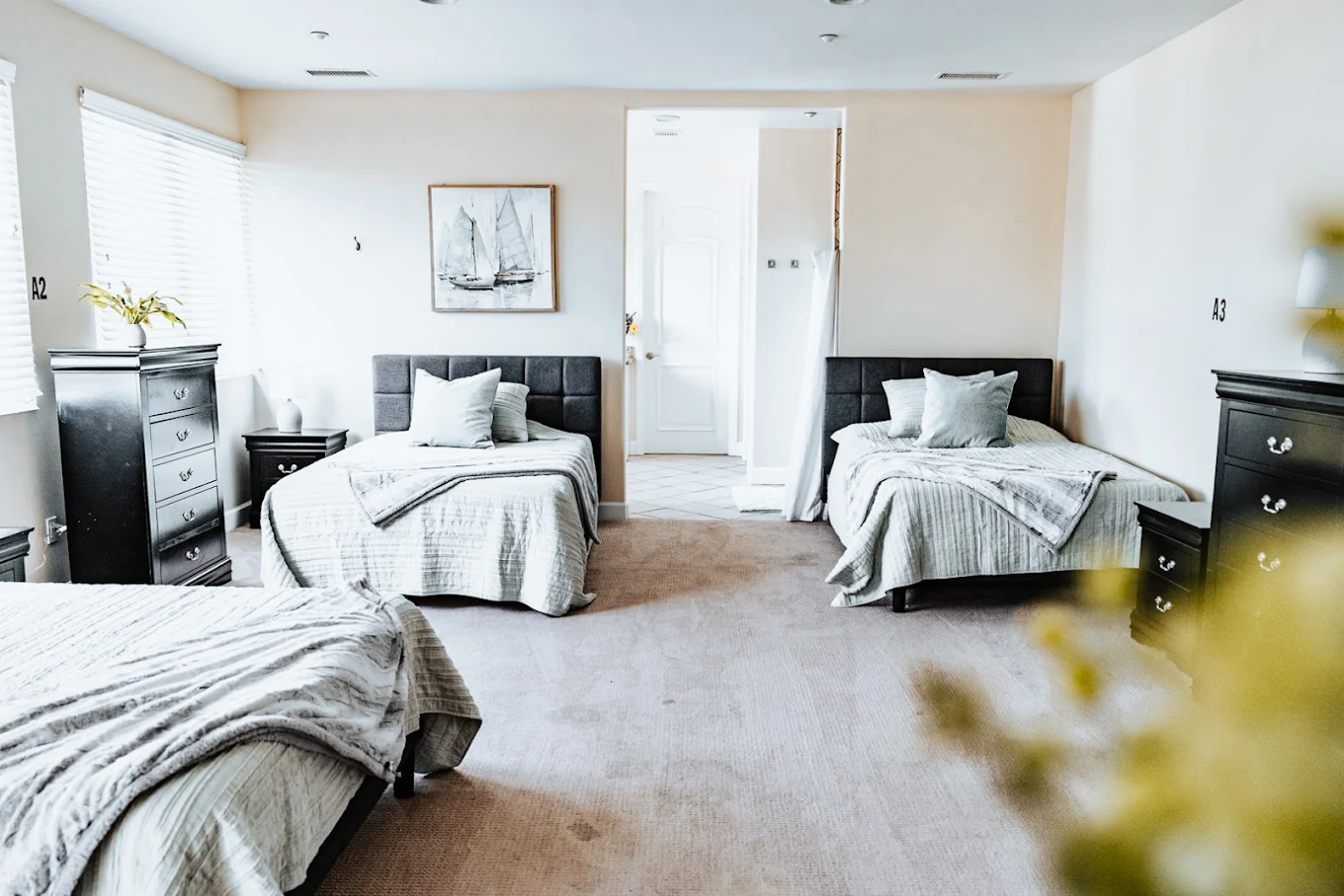 Bright shared bedroom with twin beds and soft decor