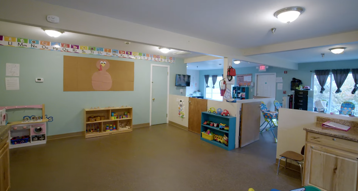 Colorful playroom with shelves of toys and decorations