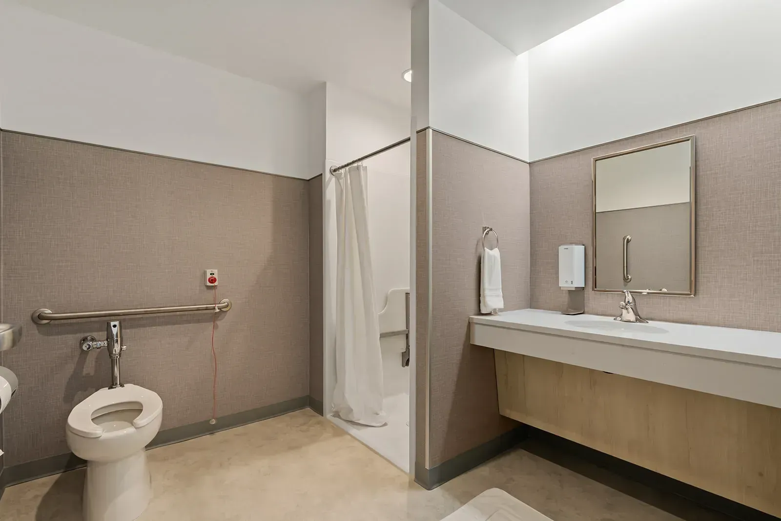 Accessible bathroom with shower and support rails