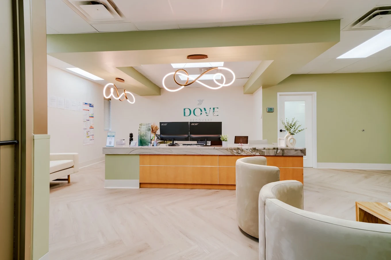 Modern reception area with front desk and seating