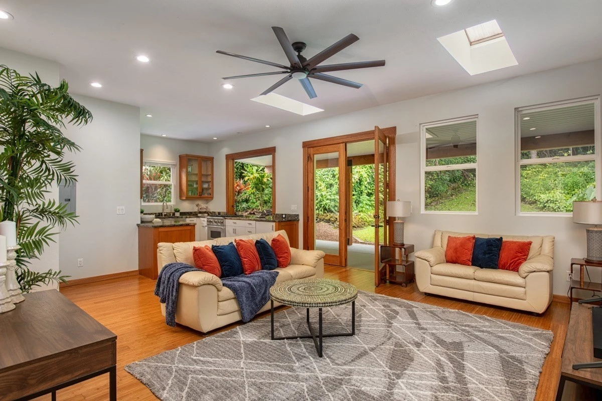 Lounge with sofas, rug, and patio access