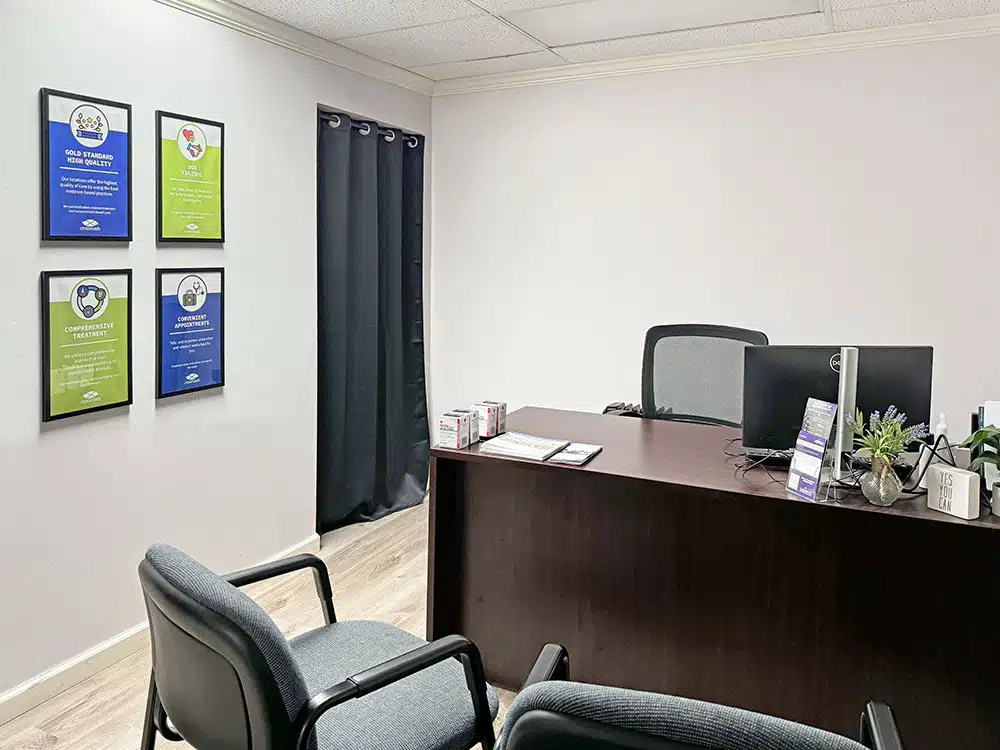 Office with desk, chairs, and motivational wall posters