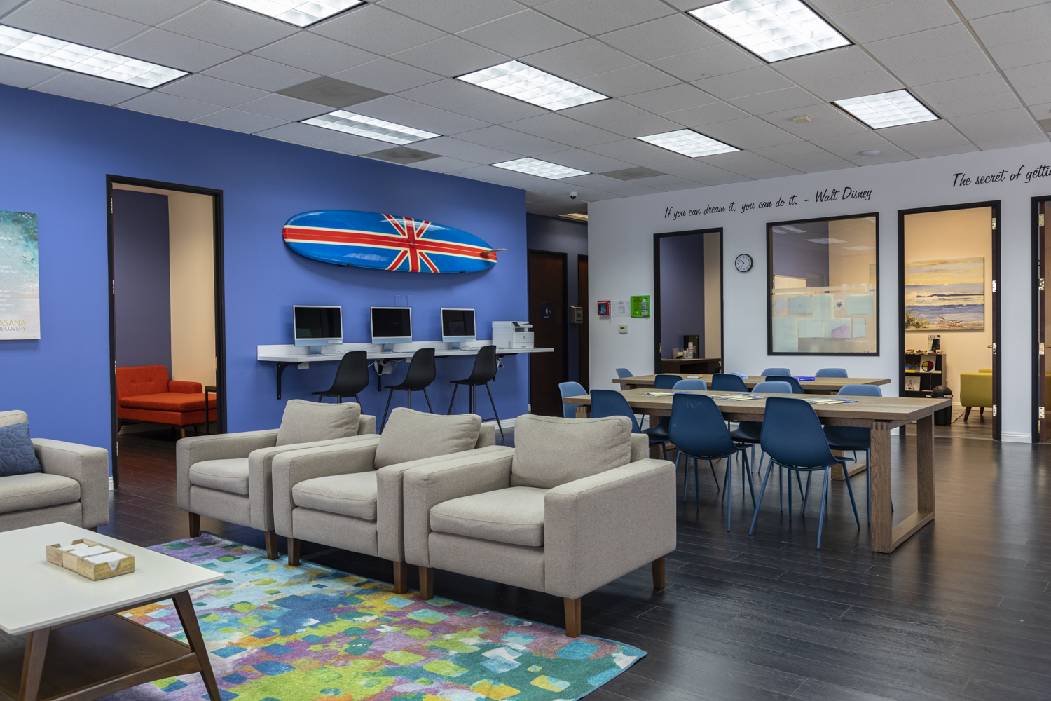 Modern lounge with sofas, pillows, and wall art