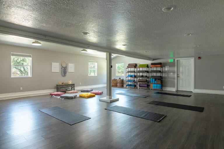 Yoga room with mats and cushions at Ascend Recovery