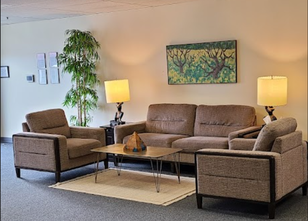 Private sitting area with plush armchairs.