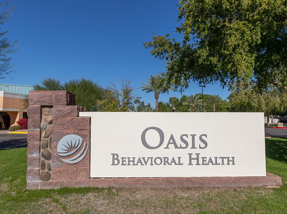 Stone and white sign reading Oasis Behavioral Health