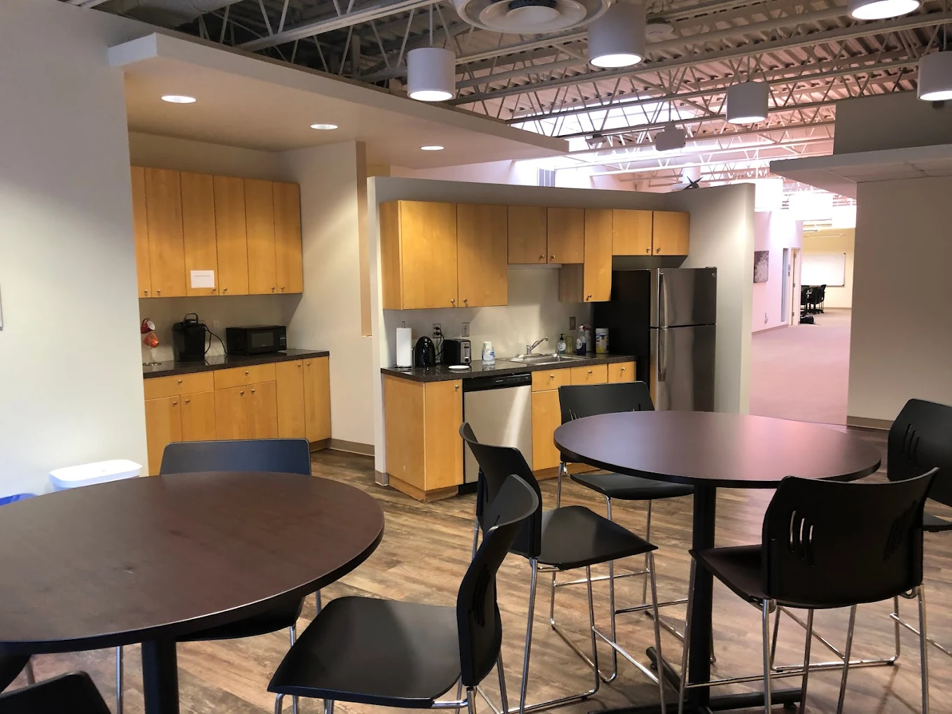 Dining tables and chairs near kitchenette area