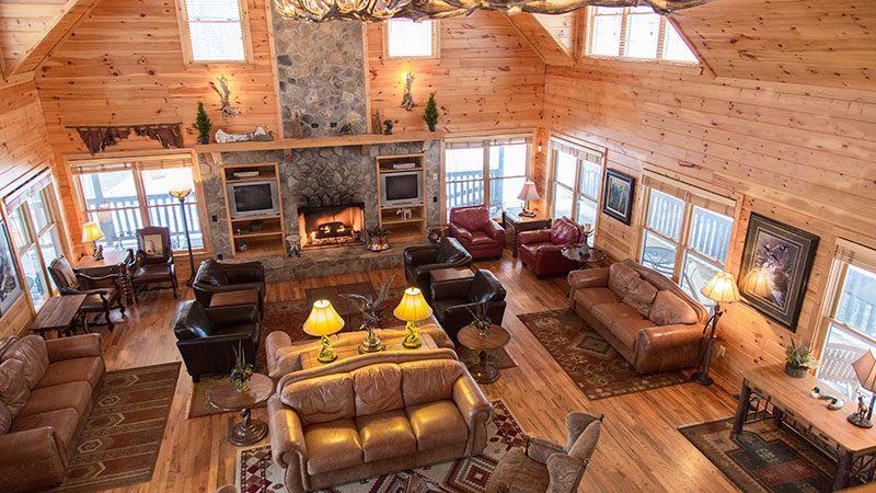 Spacious lodge interior with fireplace and seating areas