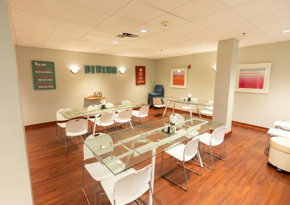 Dining room with glass tables and white chairs
