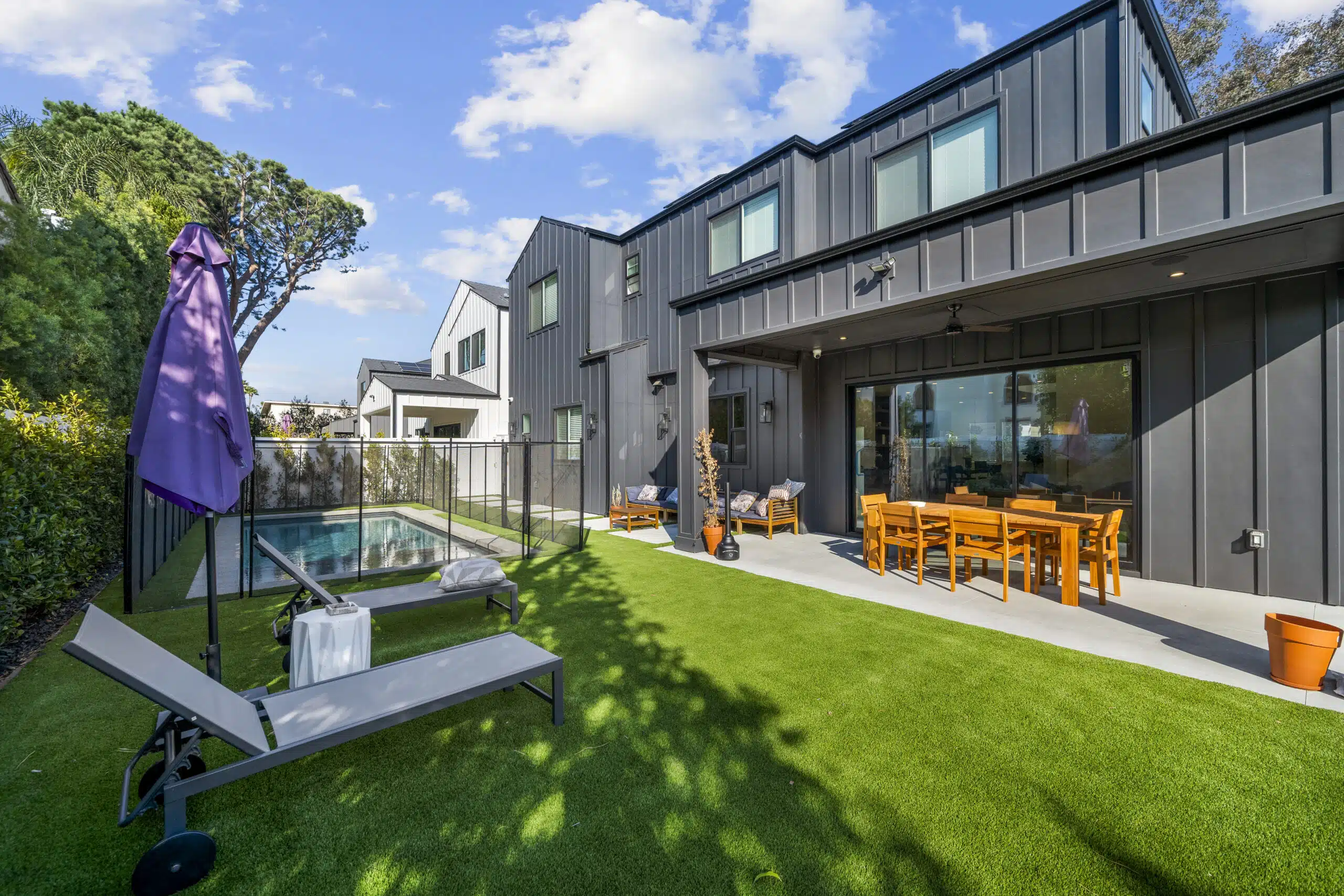 Poolside patio with lounge chairs and outdoor table