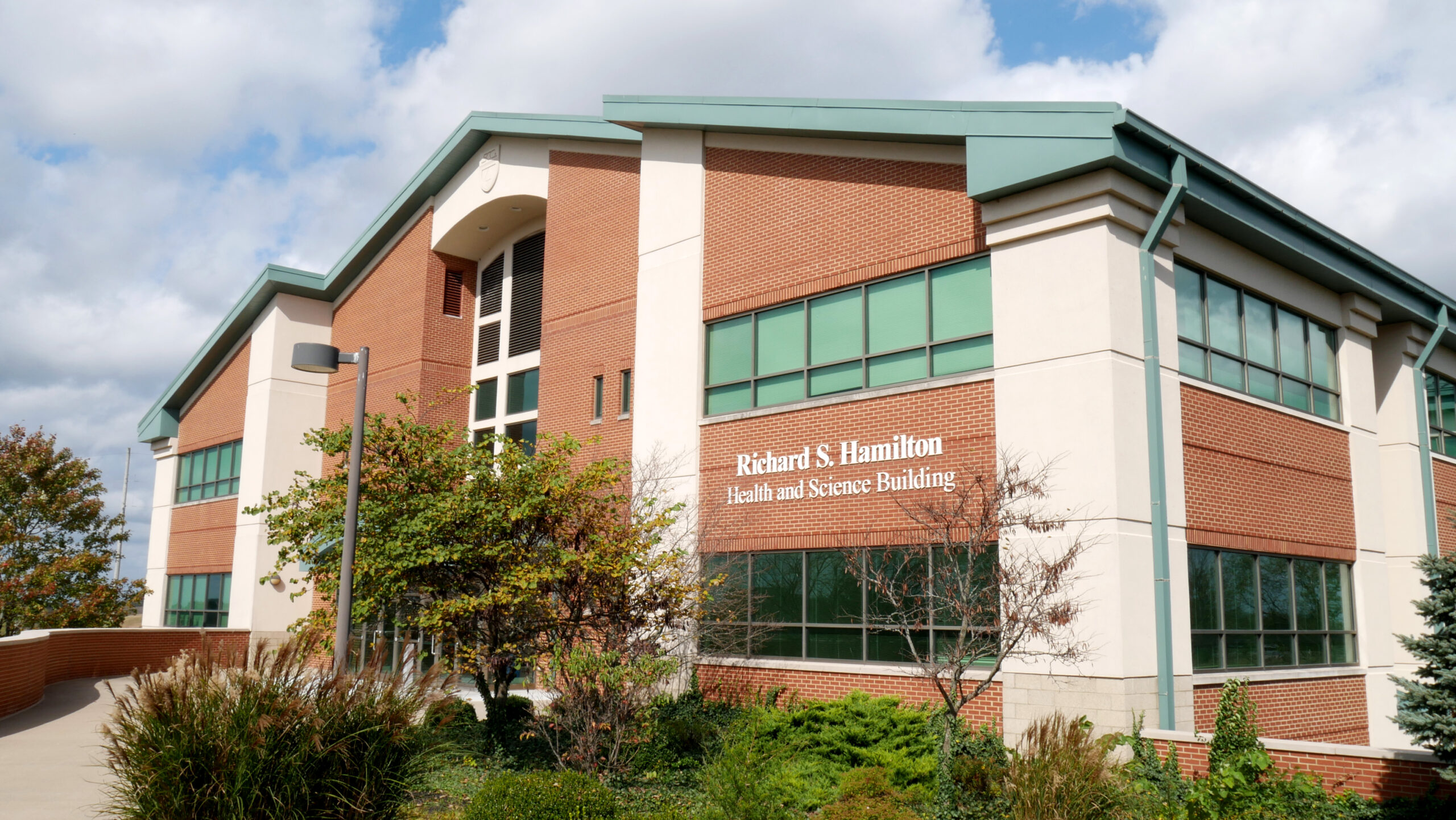 Brick campus building labeled Health and Science Building