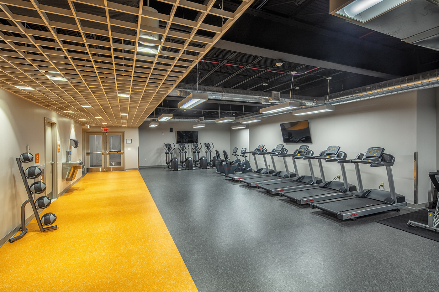 On-site fitness room with treadmills at Helio Health Elements