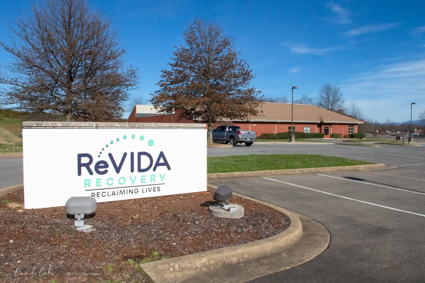 ReVIDA Recovery sign outside building and parking lot