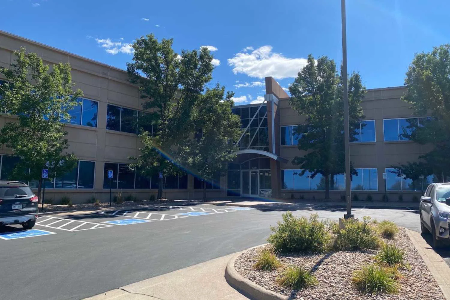 Exterior of a modern two-story building with large windows.