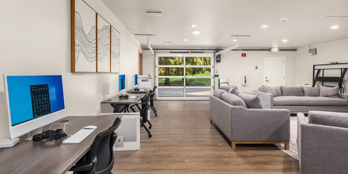 Computer workstations and lounge in bright room