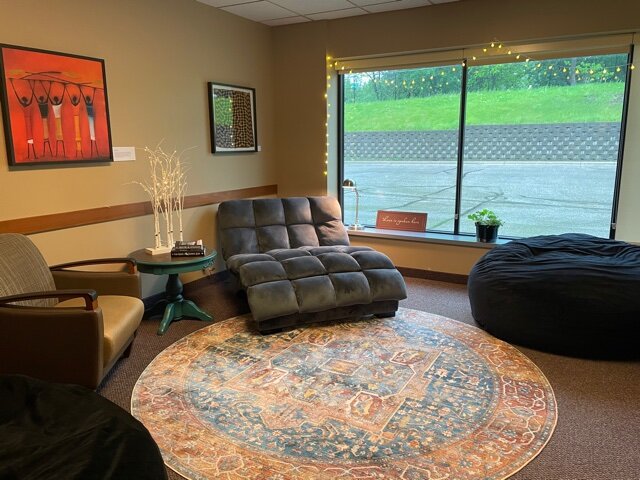 Cozy lounge with oversized chair and floor rug