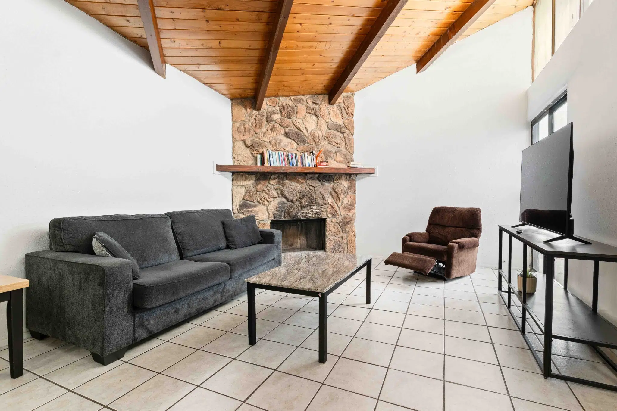 Comfortable living room with fireplace and TV