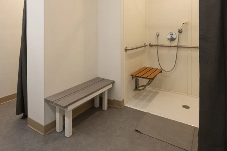 Accessible bathroom with shower bench and grab bars