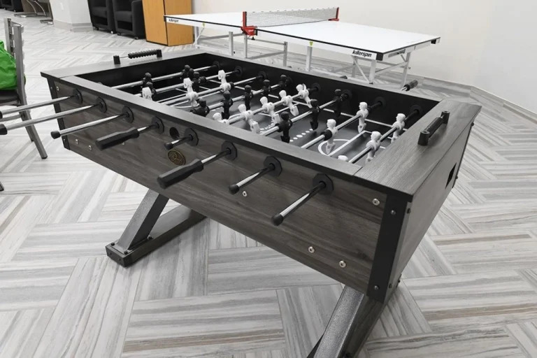 Foosball and ping pong tables in recreation area