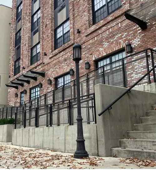 Brick building with large windows and railings