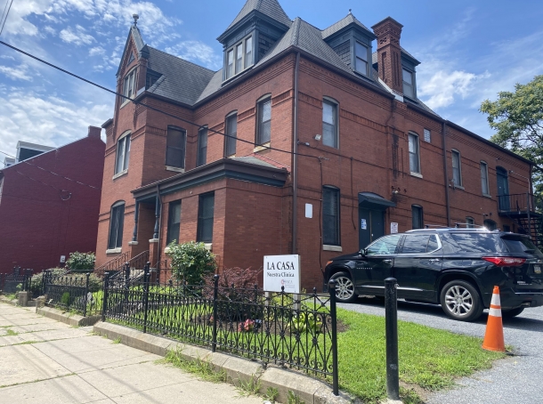 Brick exterior of La Casa Halfway House in a residential neighborhood