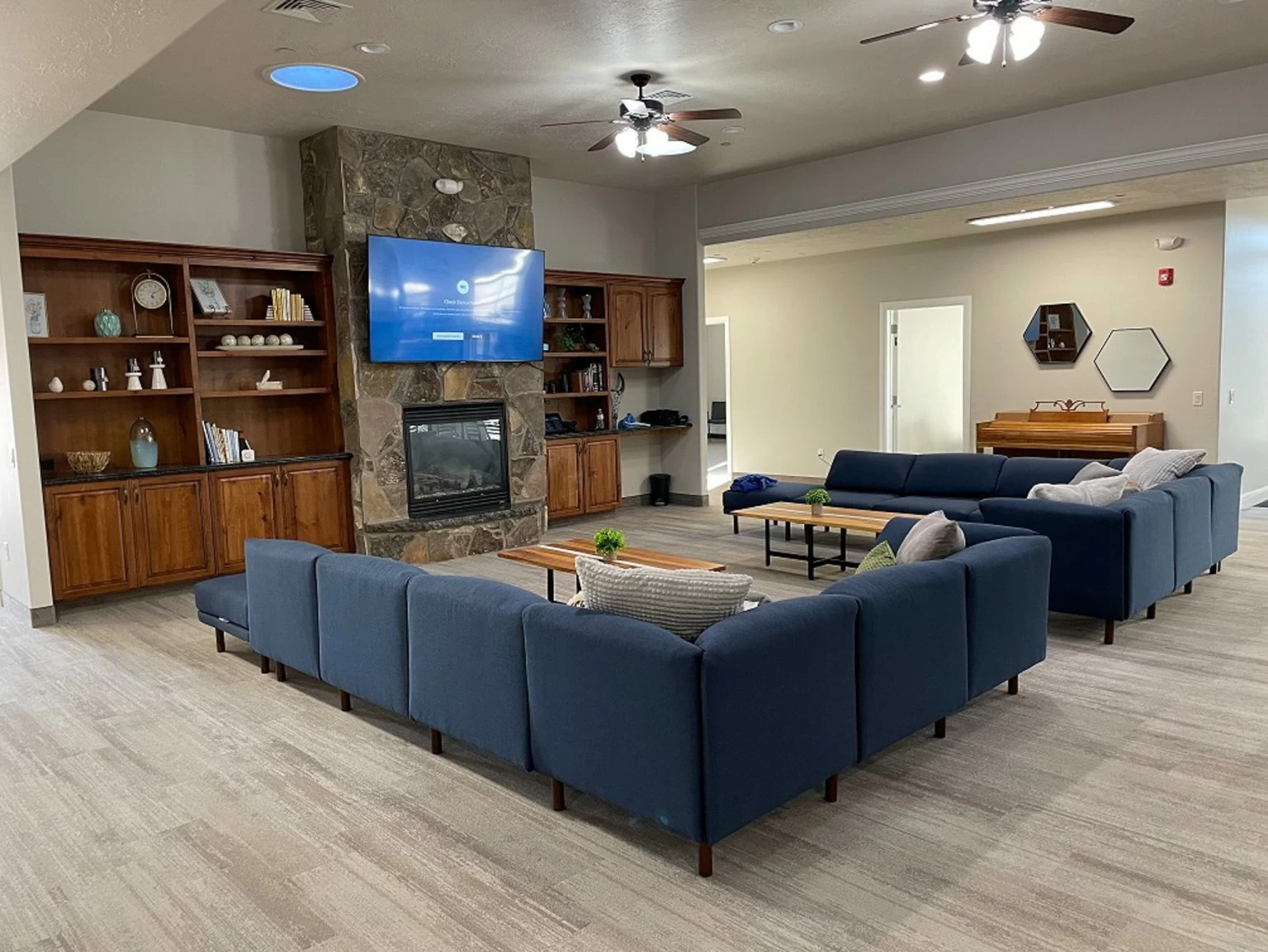 Spacious lounge with fireplace, TV, and group seating