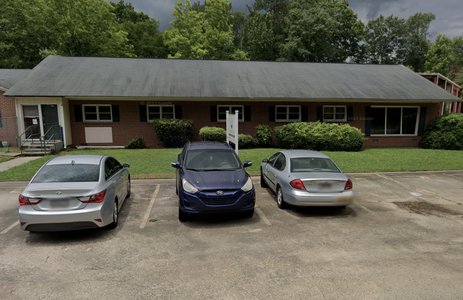 Brick treatment center building with parking lot
