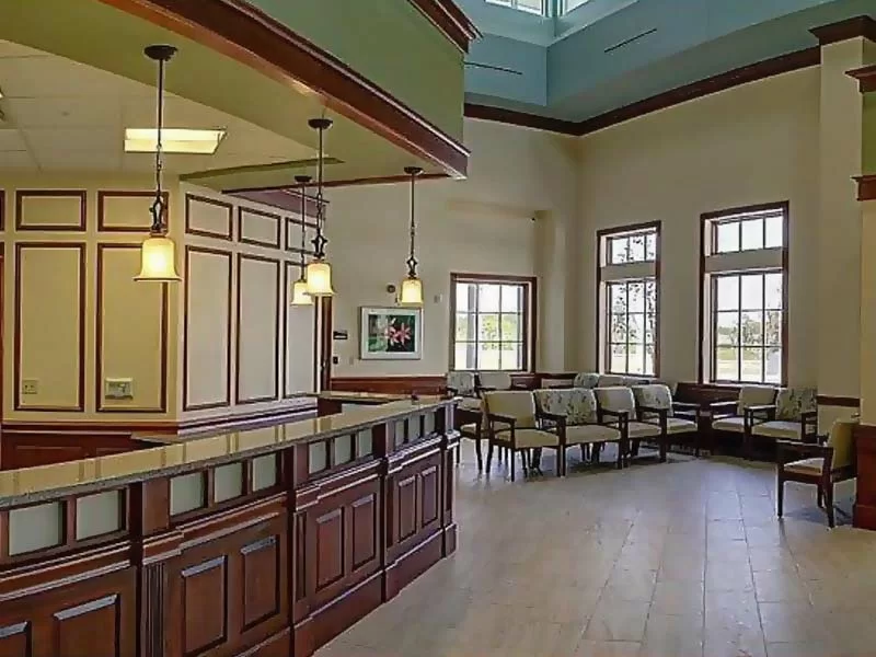 Welcome desk with pendant lighting and seating