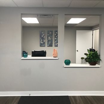 Reception window with decor and plants in a neutral room