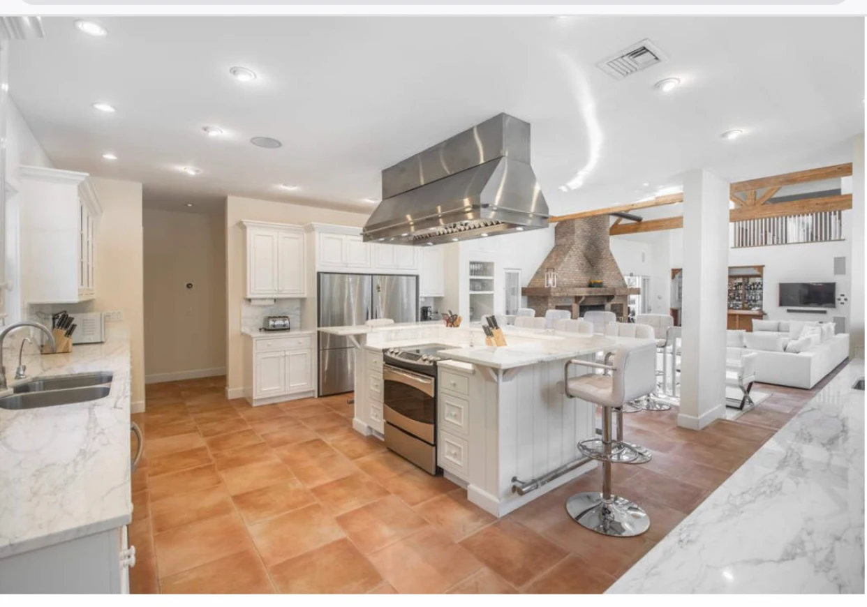 Modern kitchen with marble counters and stainless appliances