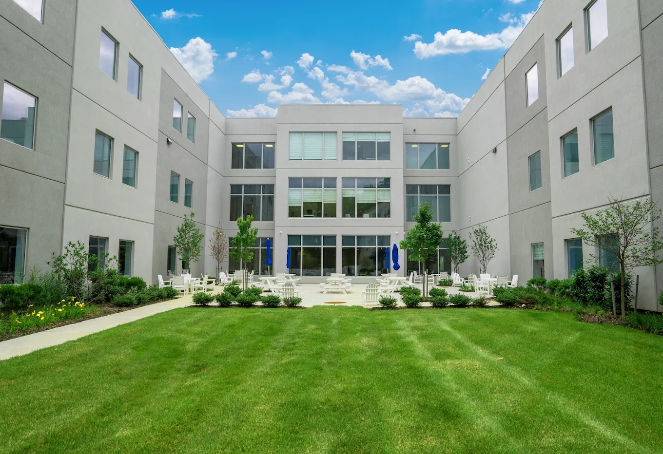 Grassy courtyard surrounded by the treatment facility