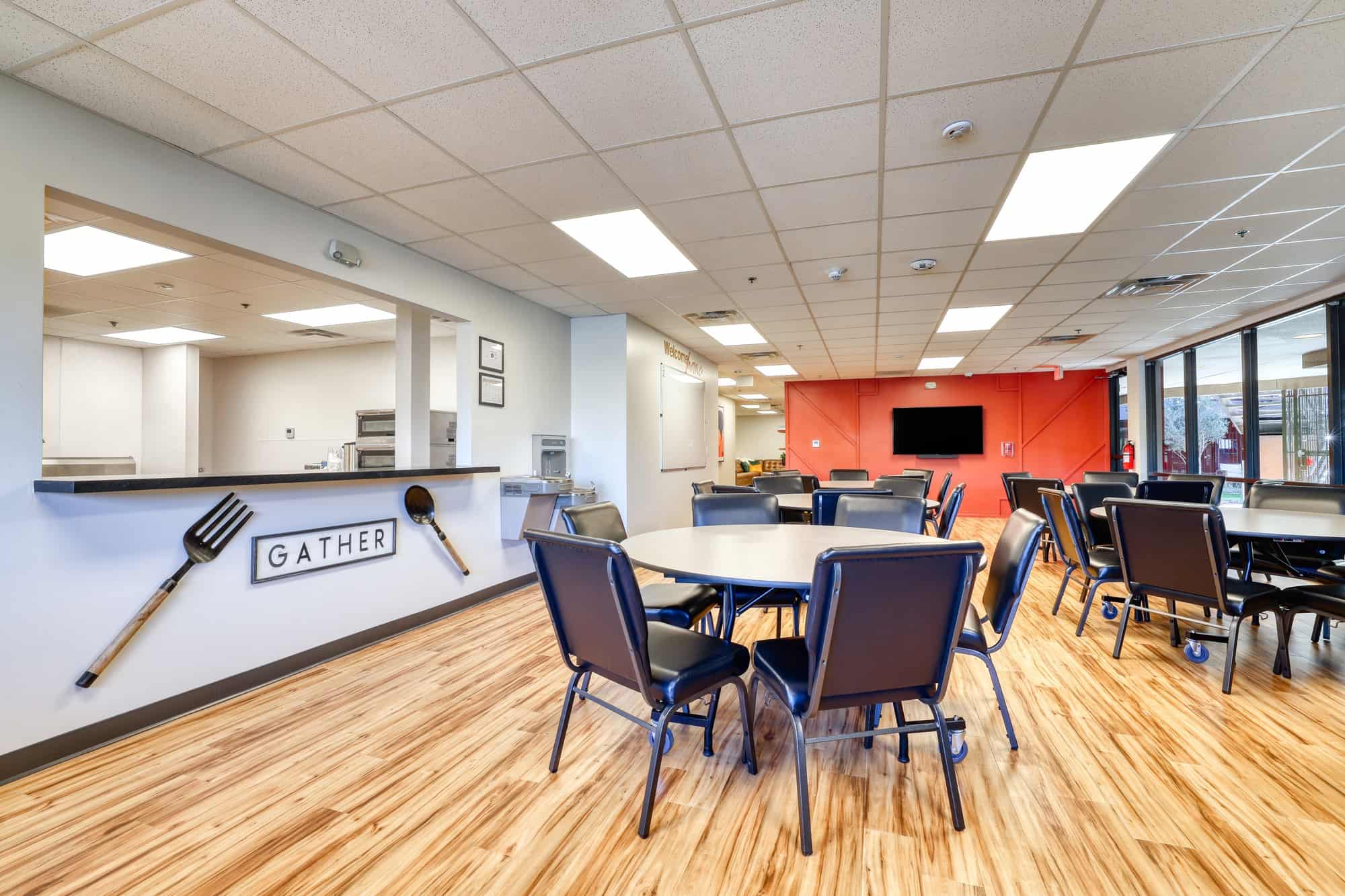 Dining area with round tables and serving counter
